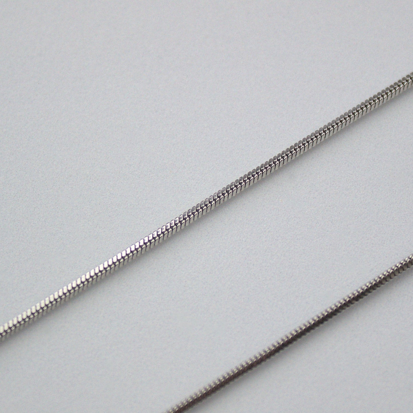 Close up 1mm snake chain.